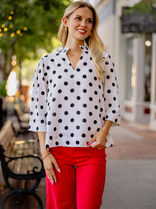 White & black polka dot blouse