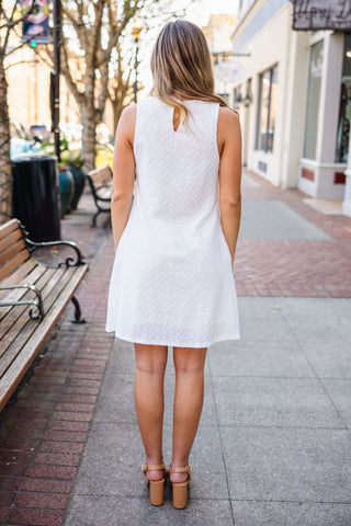White sleeveless textured shift dress