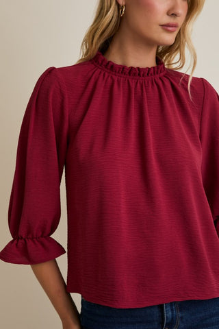 Burgundy ruffle trim blouse