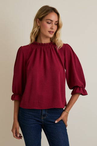 Burgundy ruffle trim blouse
