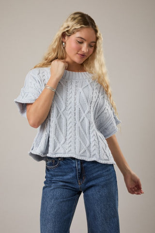 Drop shoulder cable knit sweater