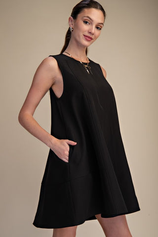Black sleeveless pleated dress