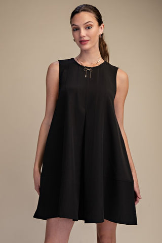 Black sleeveless pleated dress