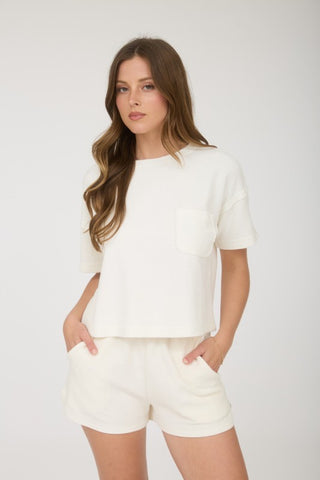 Woman wearing an off white set 