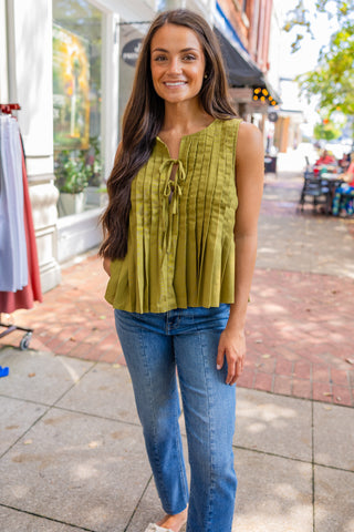 Sleeveless pleated front tie blouse