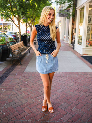 Navy polka dot sleeveless top