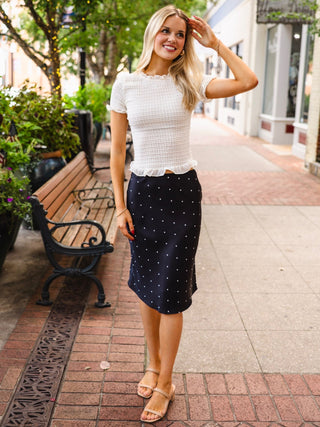 Cream ruffle smocked blouse