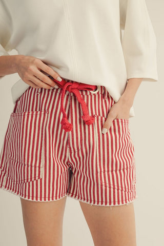 Braided belt, striped shorts