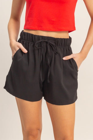Woman wearing black shorts 