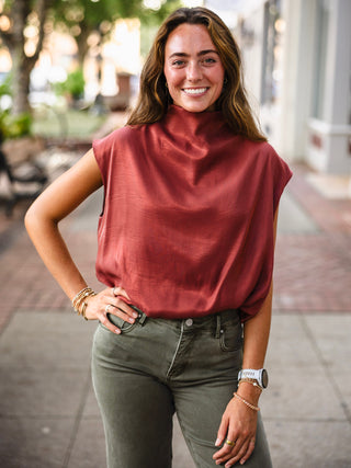 Rust mock neck bubble hem blouse