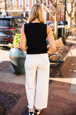 Raw edge sleeveless cardigan