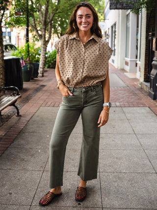 Taupe polka dot collared bubble hem top