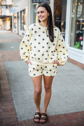 Woman wearing a polka dot set outfit 