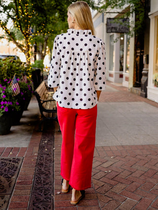 White & black polka dot blouse