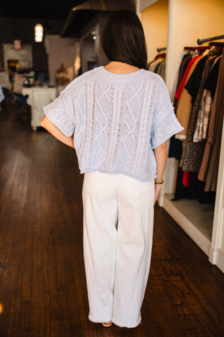 Drop shoulder cable knit sweater