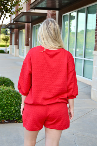 Red textured half sleeve top