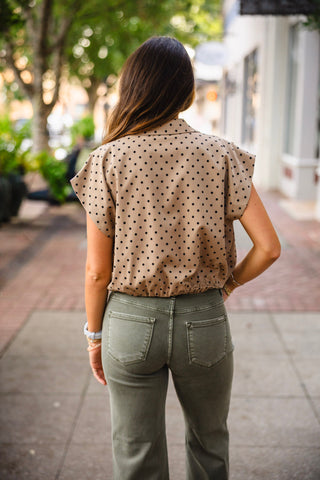 Taupe polka dot collared bubble hem top