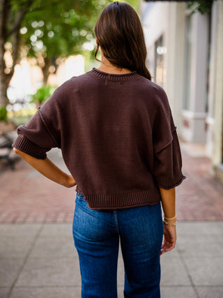 Exposed seam drop shoulder half sleeve sweater