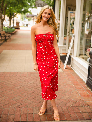 Red polka dot strapless dress