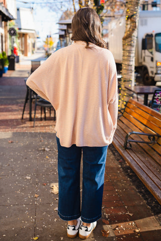 Oversized striped turtleneck top