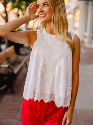 White floral print sleeveless blouse