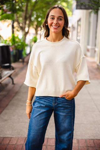 Exposed seam drop shoulder half sleeve sweater