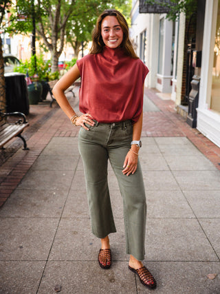 Rust mock neck bubble hem blouse