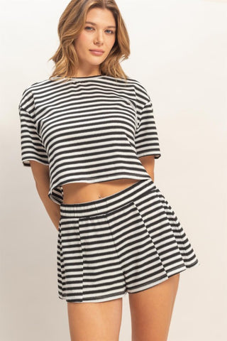 Woman wearing a black and white striped set